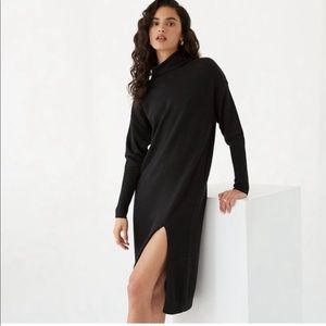 Wilfred black sweater dress with high slit.